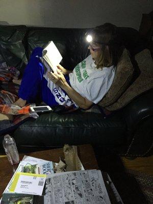 my wife enjoying her book because we have no power! bury the ele lines!