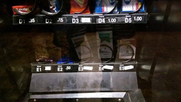 Cigarettes in the vending machine. Don't select A3...it's a neon green dildo. Just kidding. It's actually a roofie.