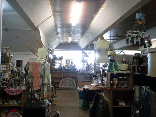 Interior of the Antique Mall - note the toy vehicle mobile at the upper right, and the lime-green high-heeled sneakers slightly below!