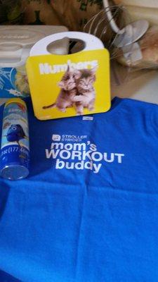 Prizes from opening day. Little man likes his shirt.