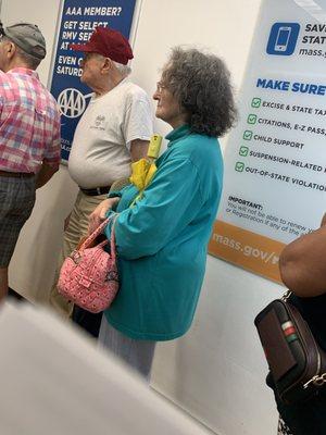 Older white couple who was let inside the build while I waited