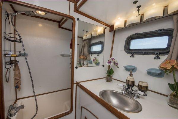 Both bathrooms have full facilities with tubs and showers