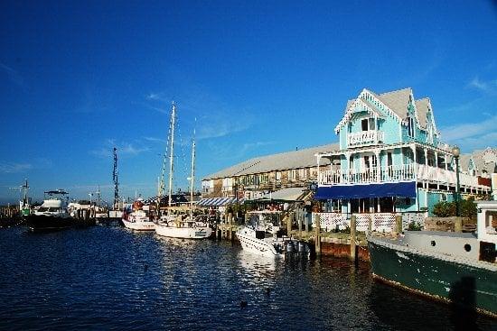 The restaurant is both the downstairs and upstairs of the aqua-colored building.