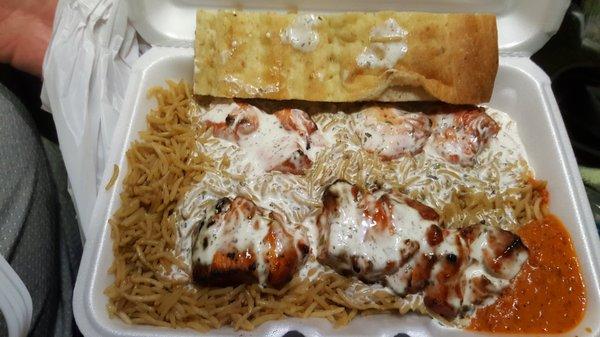 2 Chicken Skewers w/ rice + white & hot sauce