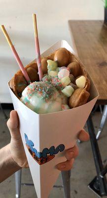 Eg waffle, lychee ice cream, mochi, pop rocks, Pocky and blue coconut syrup