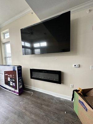 70 Inch Full-Motion Tv Mount Installation w/ In-Wall Wire Concealment & Mounted Fireplace In Waldorf, Md