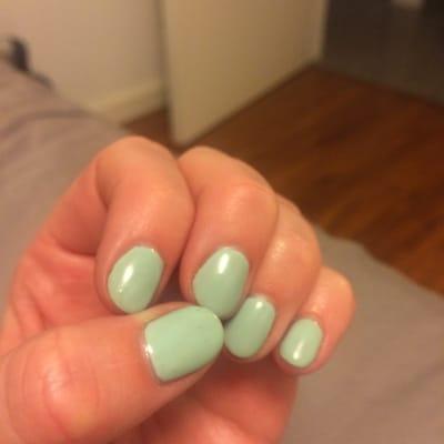 Zoom in. Bubbles rose through the gel in places, so the manicure isn't nice and smooth... it's bumpy and looks like flecks settled on top.