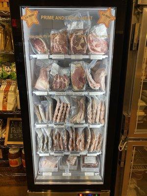 Meat freezer stocked with local and prime meats, as well as handmade sausages