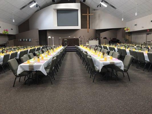 Setup for a dinner in the Worship Center