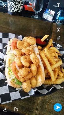 Shrimp po boy and fries. Cooked to perfection.