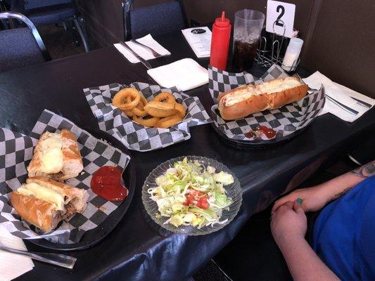 Steak hoagie, meatball hoagie, onion rings and house salad with house dressing. Great portions and great service.