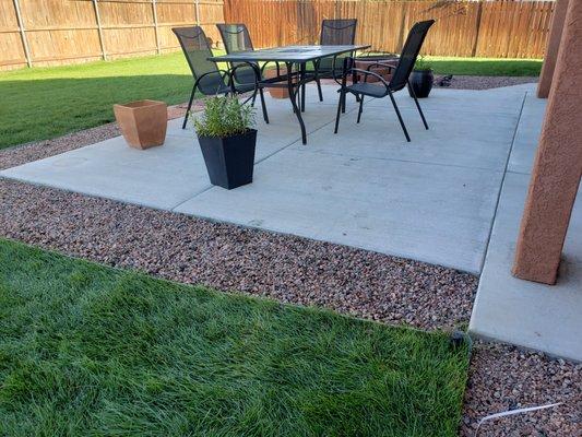 Concrete patio and landscaping.