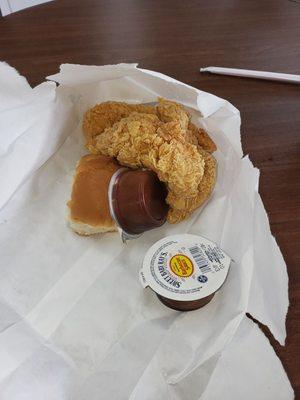 3 piece strip with a roll and sauce.