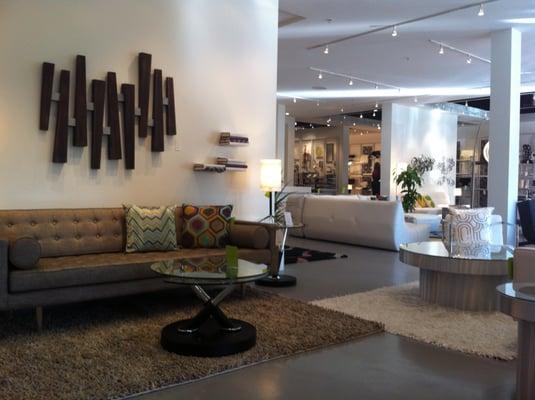 Abby Sofa, Anemone Rug, Transit Tables, Parallel Wall Art, Inner Circle Lamp, Invisible Book Shelf