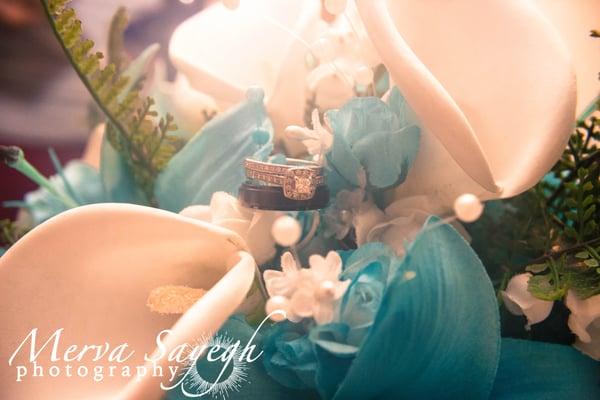 Beautiful shot of the bride and groom rings on the bouquet.