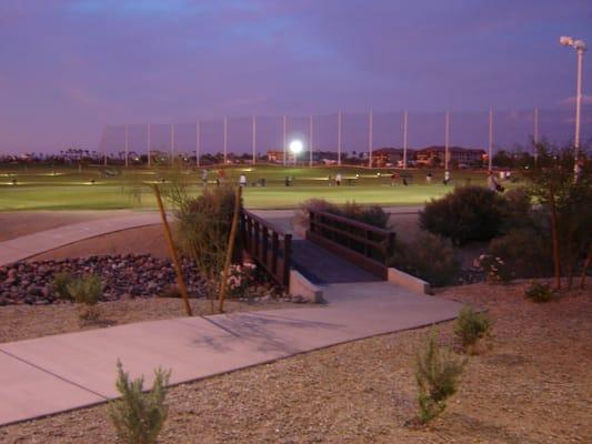 Bridge to tee reall grass box at night.