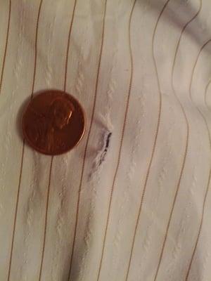 Here's a hole from one of the shirts I took here for cleaning. There were a bunch of holes like this in the shirt.