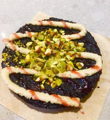 "Pothole" Vegan brownie with tahini creme, strawberry drizzle and pistachios. So delish!! $5 #somethingneweveveryday