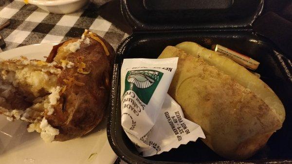 "loaded" potato on the left with less than an ounce of toppings?