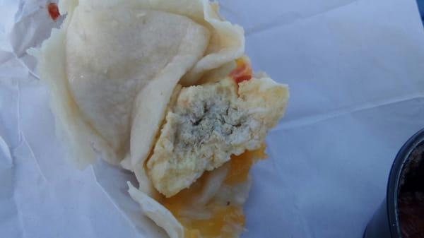 Noticed the bluish, green tint (2 late) in the middle of my turkey burrito(supposed to have potatoes and YELLOW eggs) disgusted