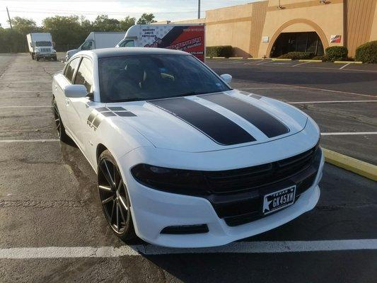 I got my roof wrapped black, RT package decals and blacked out headlights and tail lights. Hope it's street legal.
