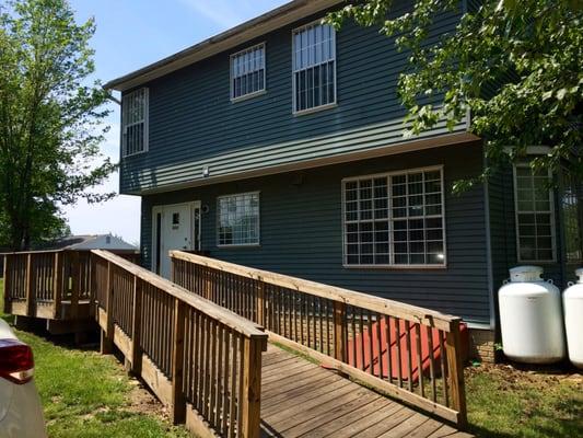 Entrance & parking lot is in the rear. Handicap accessible.