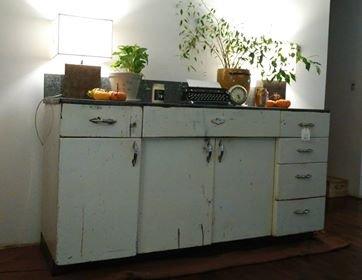 Old metal kitchen cabinet turned entryway console. Perfect.
