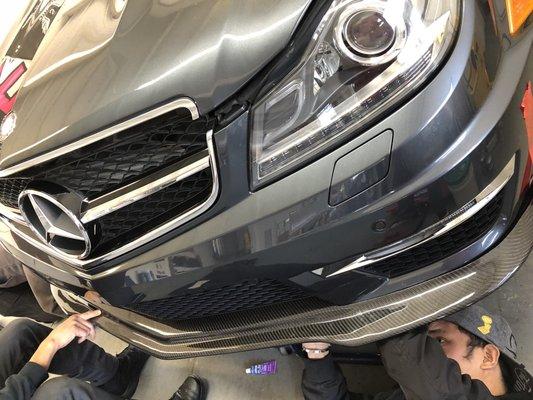Carbon fiber front lip and diffuser installed on my C63 AMG