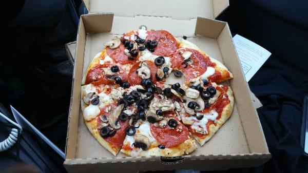 Pepperoni, Mushroom, Olive and Garlic pizza.