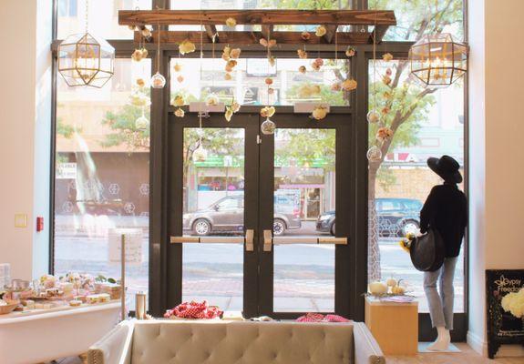 Showroom Entrance, Home + Body Bar, Window Dressform Display, Floral Chandelier, Chandelier Lights