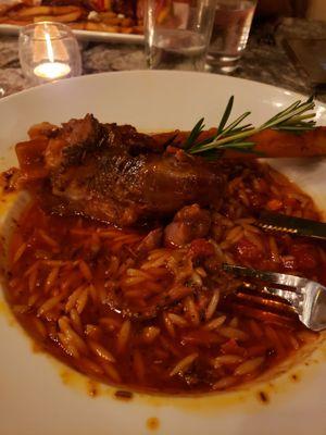 This is tge lamb shank swimming in greasy sauce, which you can see looking at the tines of my fork and rim of the plate.