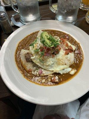 The house specialty "Huevos Dias" with carnitas and their amazing homemade ranchero sauce! The fresh orange juice was so good as well.