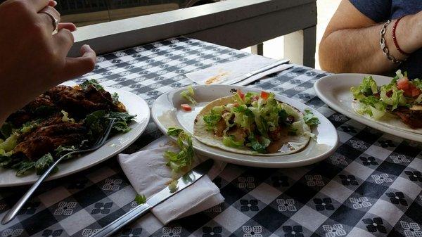 Fish tacos and blackened chicken over Caesar salad