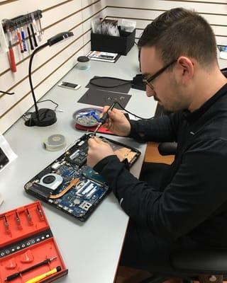 Technician and Owner Josh Gelman, works a charging issue on location.