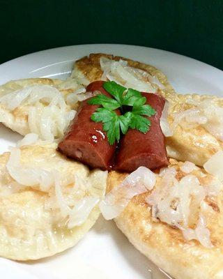 Pierogies topped with Polish Sausage.