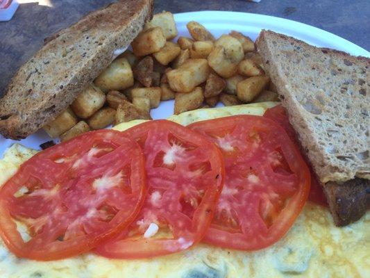 This place is a hidden gem. Spinach and feta omelette with tomatoes added. Delicious.