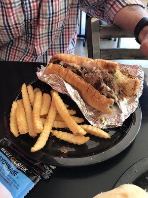 Philly Cheesesteak with Fries (Started eating before snapping a pic)