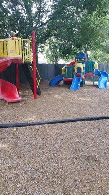 Outdoor play equipment in shaded area