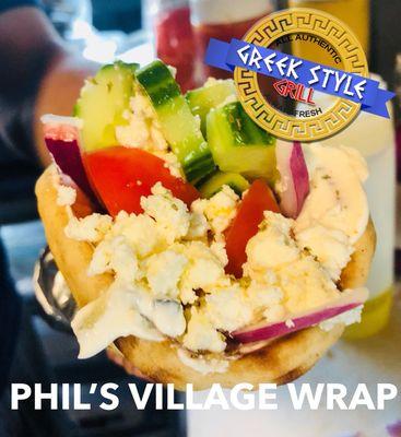 Our Greek village salad wrapped in a toasty pita!