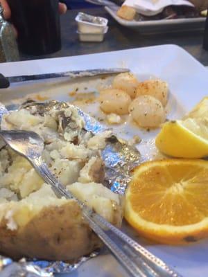 The plate includes the half baked potato; Sea Scallops( smallest I've ever seen) ; orange and lemon slice. Do you see $15 entree ??
