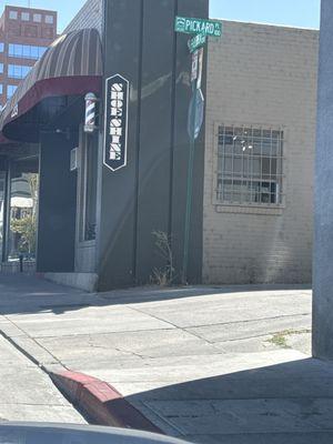 A barber lounge on the corner.