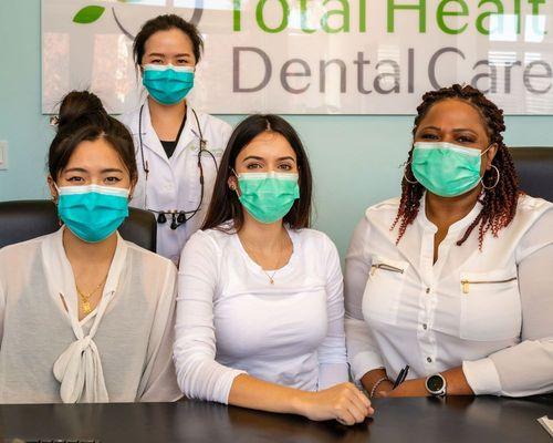 Total Health Dental Care staff members following COVID-19 pandemic protocol.