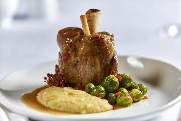 Hand seasoned, slow braised 24 oz. shank with an apple brandy pork demi-glace.