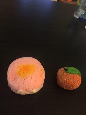 Sweets. The left is a rosewater sweet bun and the right is a sweetish dough made to look like a fruit.