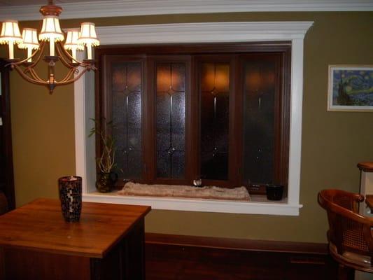 Cherry woodgrain 4-lite bow window with frosted glass and v-groove glass