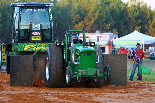 John Deere pulling Pioneer Seed Sled