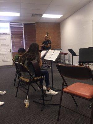 Guitar lessons with Gene Moore. He is so patient with the kids and makes everyone laugh to ensure that all students have fun learning.