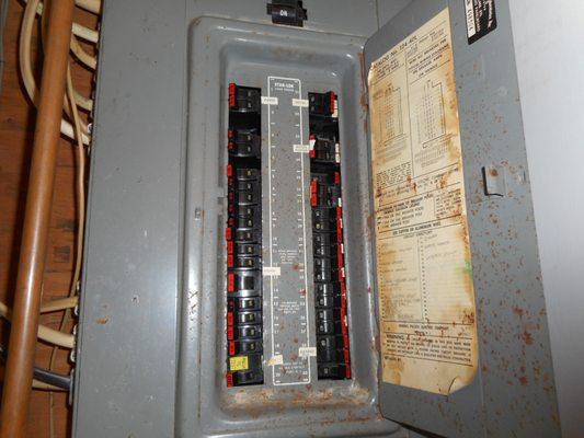 The interior of an FPE panel, with the very distinct red breaker tips. FPE panels should be replaced.