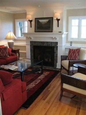 Architectural interior remodel and interior design of a 1928 craftsman farm house. New windows, foyer, panneling and fireplace.