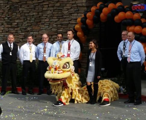 With the big bosses and the lion dancer.